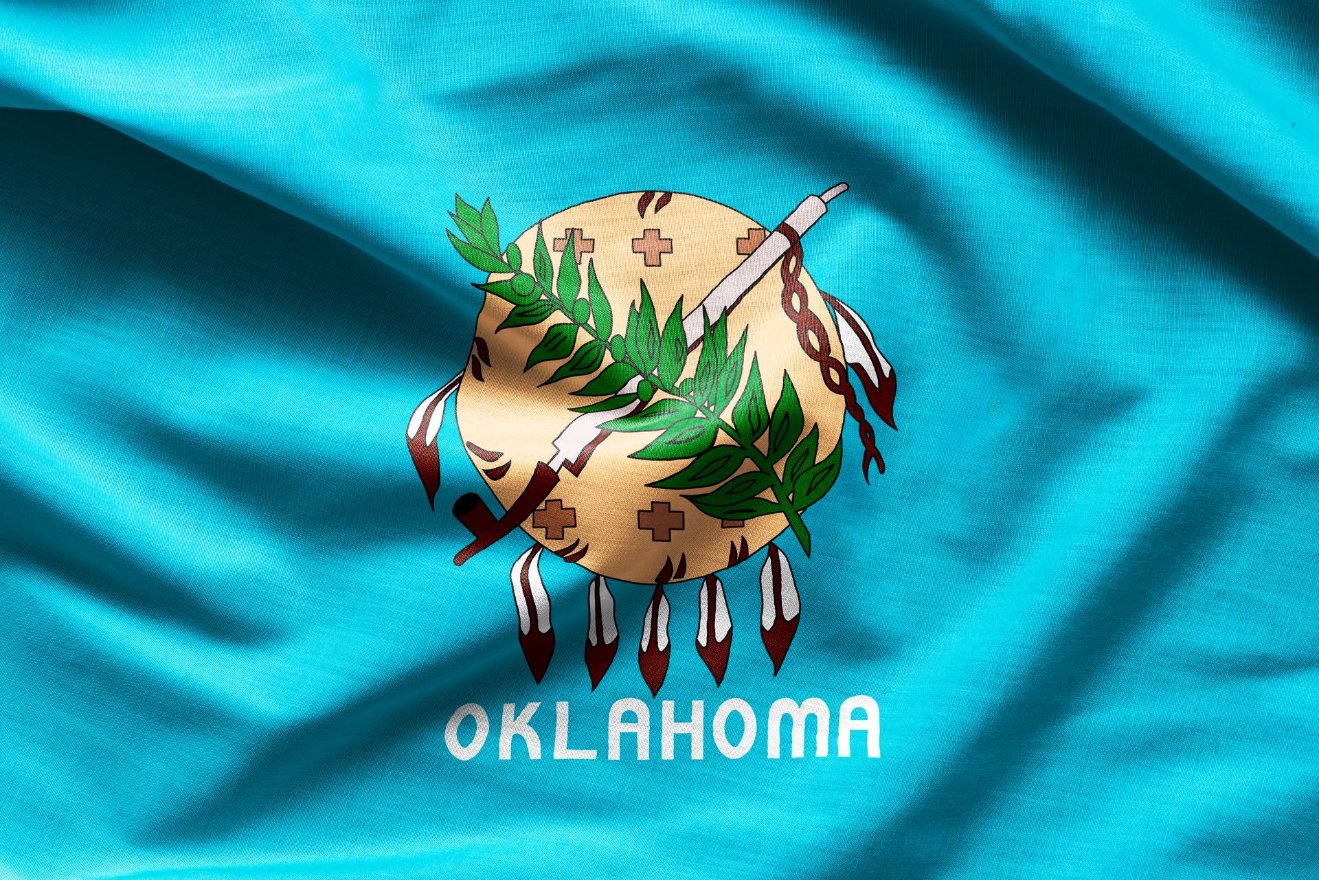The flag of oklahoma is waving in the wind
