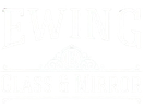 White storefront sign reading &ldquo;EWING&rdquo; and &ldquo;GLASS & MIRROR&rdquo; with a faint emblem in the center