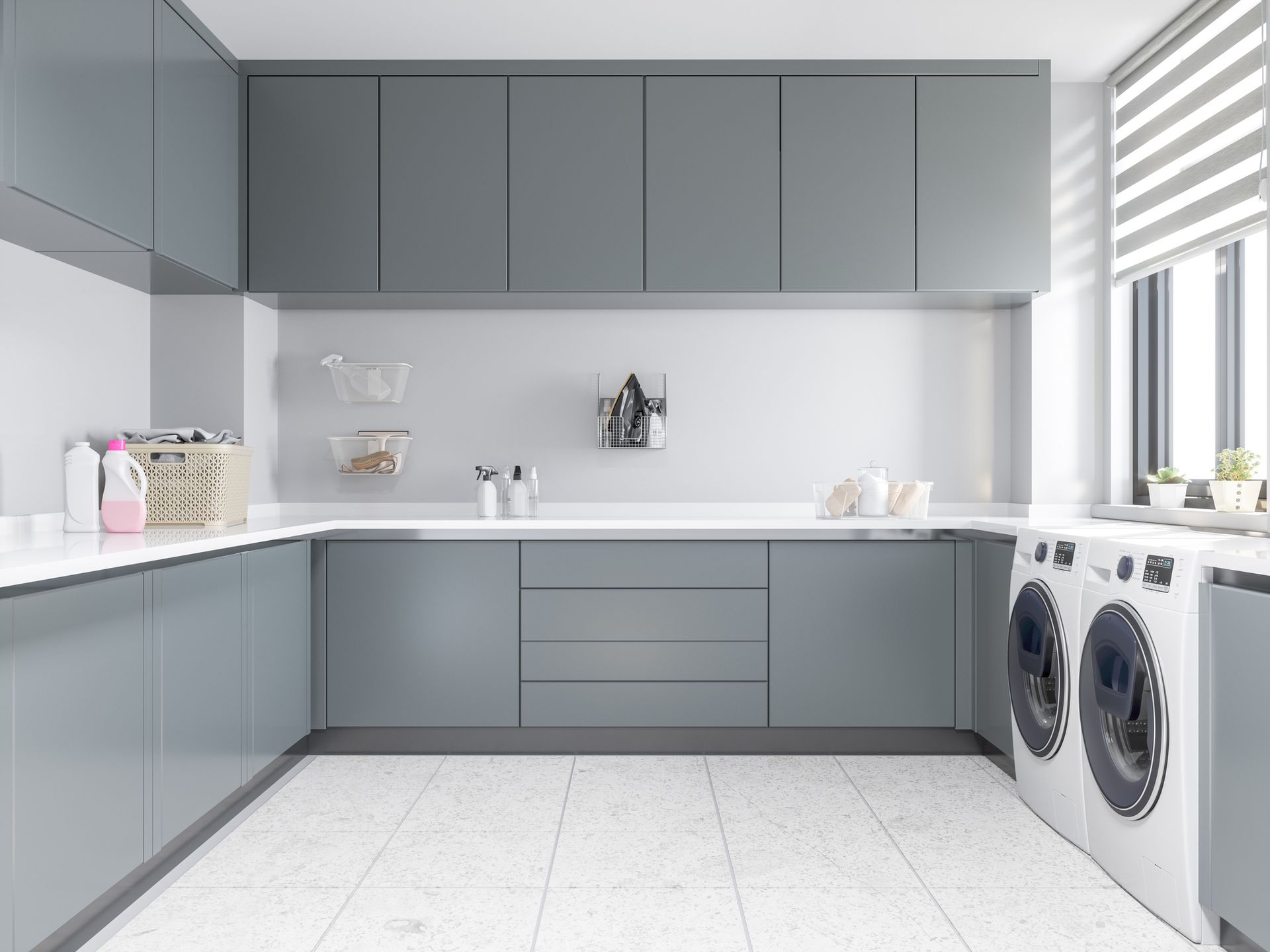 It is a laundry room with a washer and dryer.