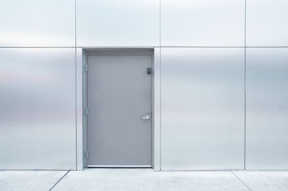 Interior Metal Door — Closed Grey Metal Door With Steel Wall in Houston, TX