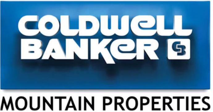 The logo for coldwell banker mountain properties is blue and white