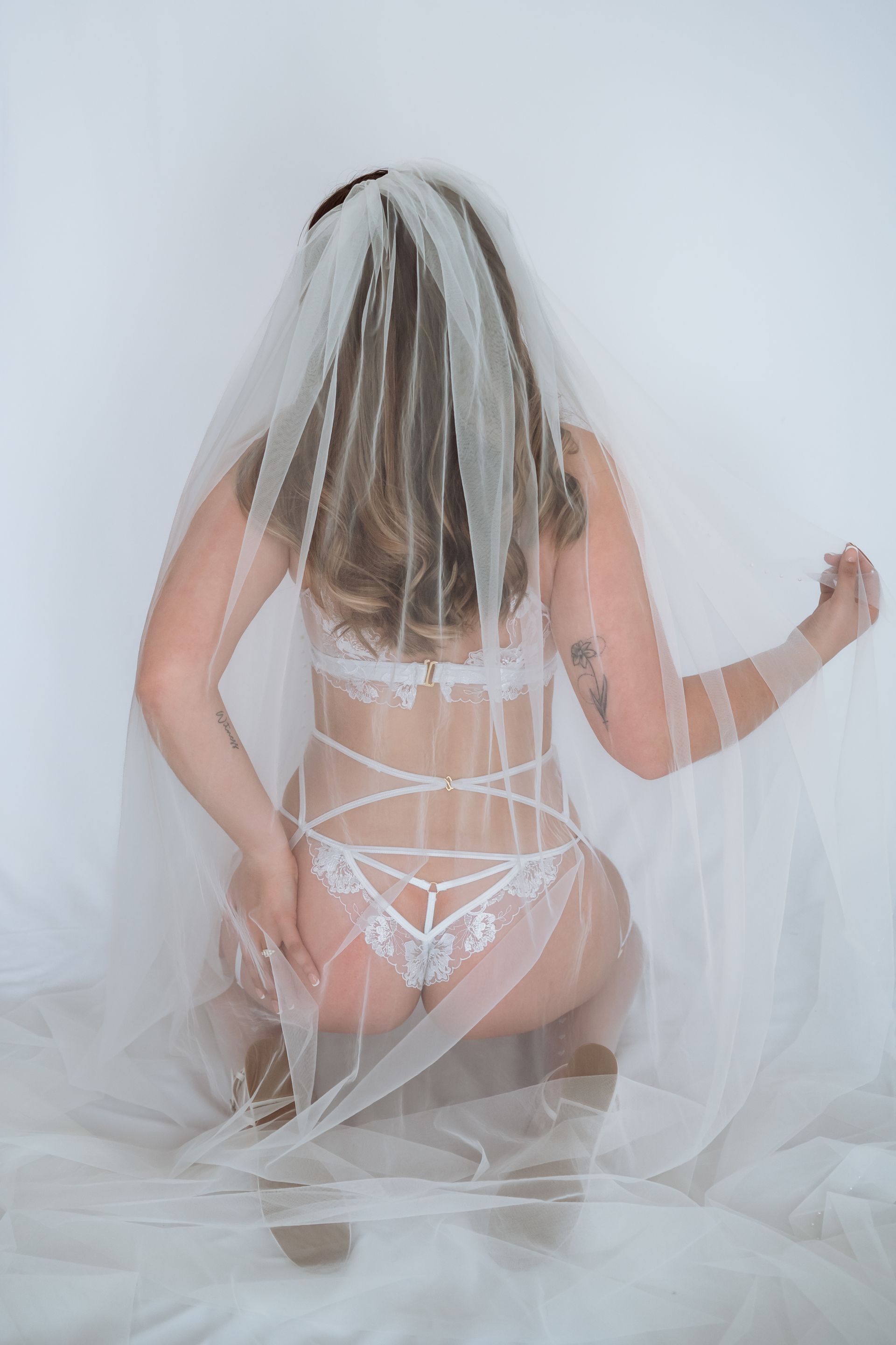 a woman in white lingerie from behind