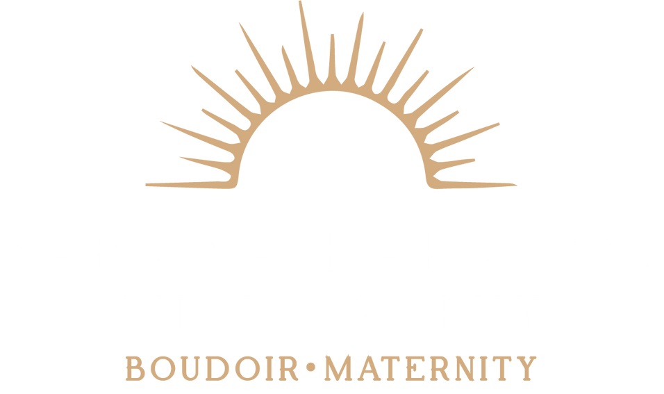 A logo for a photography studio with three trees in the background.