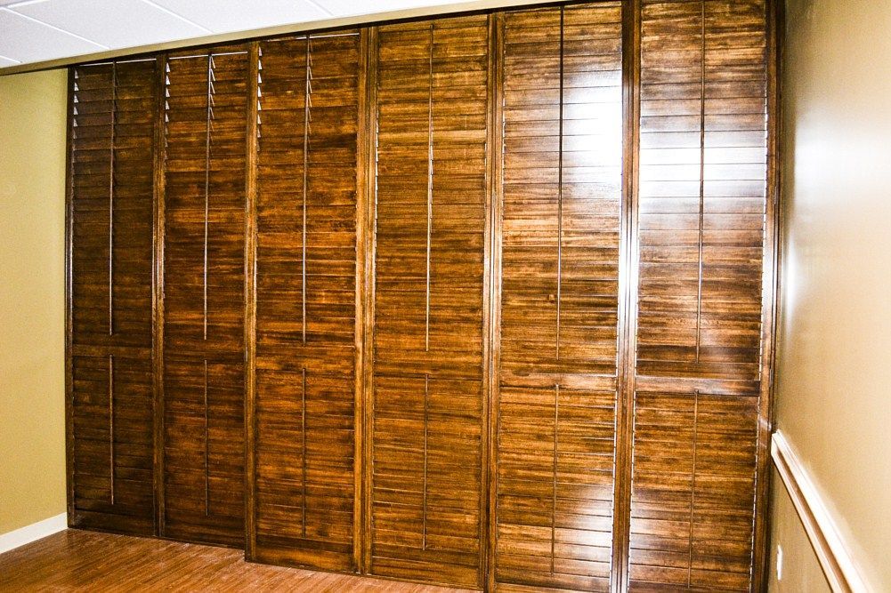 A room with a wooden wall and a wooden floor