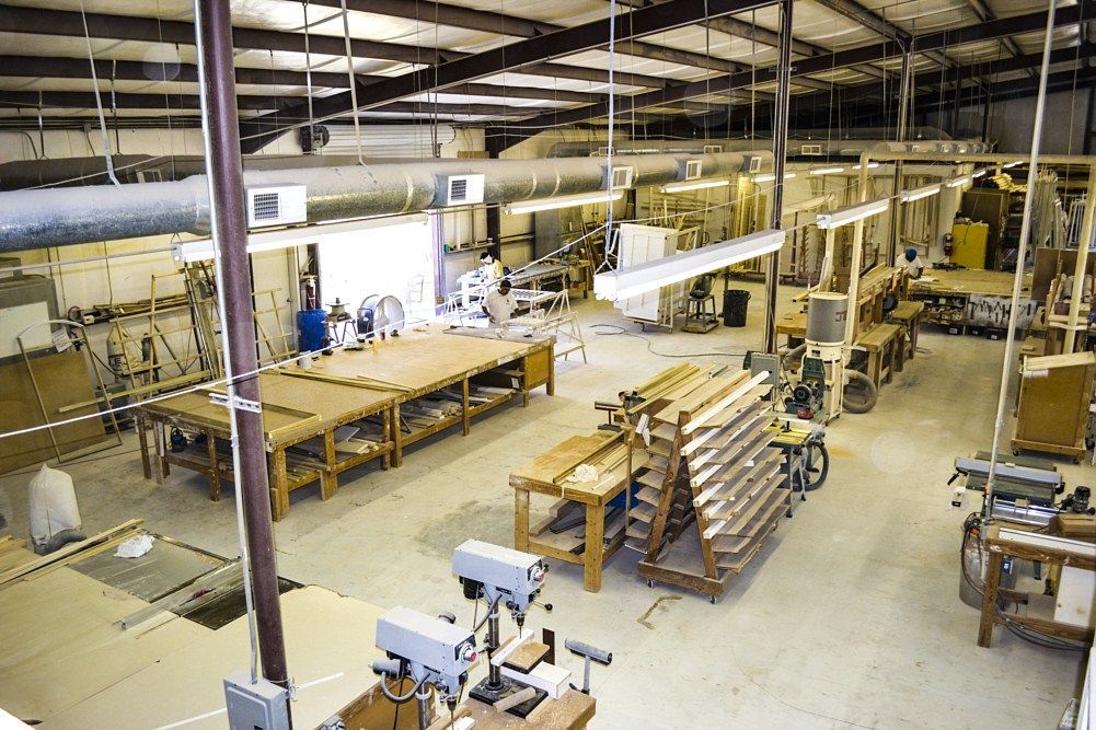 A large warehouse filled with lots of woodworking equipment