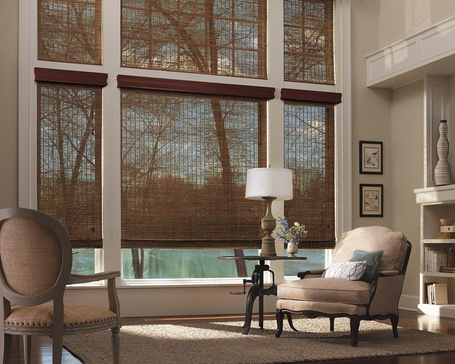 A living room with a chair a table and a lamp