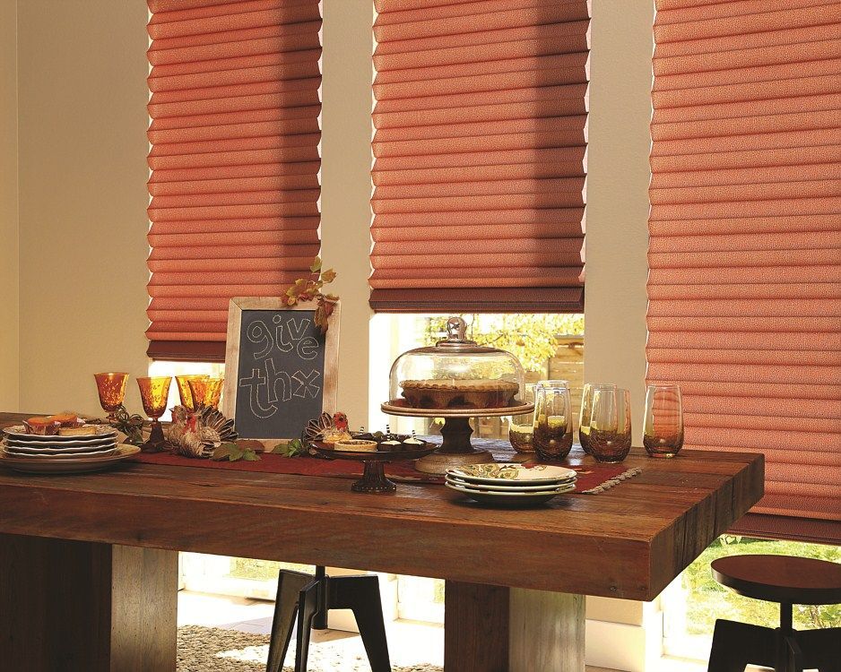 A dining room table with plates , glasses , and a sign that says ' i love you ' on it.