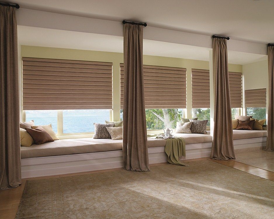 A room with a lot of windows and curtains