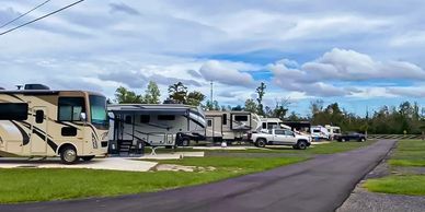 A row of rvs parked on the side of a road.
