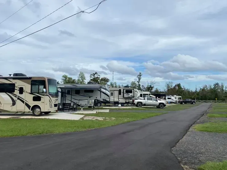 A row of rvs parked on the side of a road.