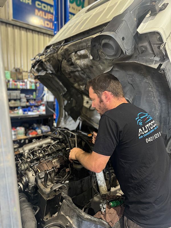 Mechanic Is Working On A Car Engine — Autocool Air Conditioning in Raymond Terrace, NSW