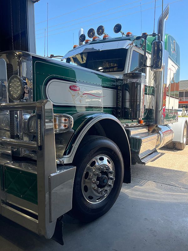 A Green And White Semi Truck Is Parked On The Air Conditioning Repair Shop — Autocool Air Conditioning in Raymond Terrace, NSW