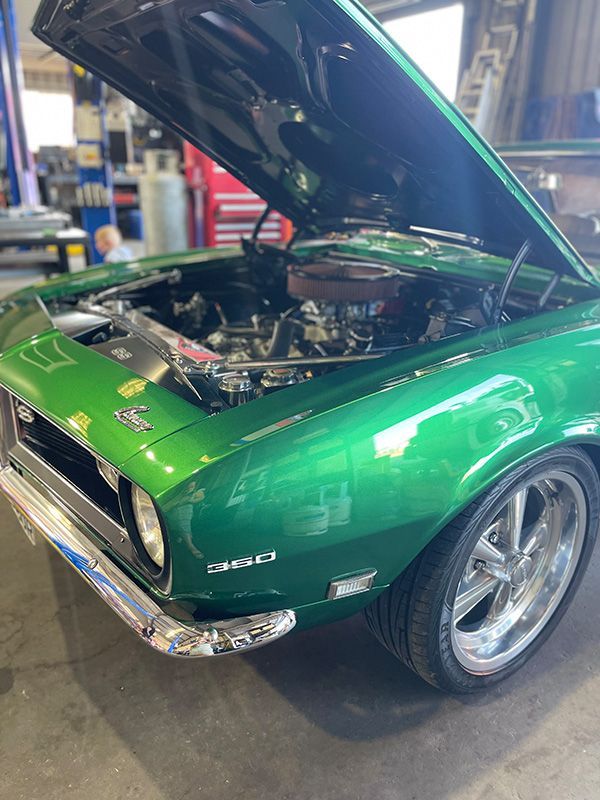 A Green Car With An Open Hood Engine — Autocool Air Conditioning in Raymond Terrace, NSW