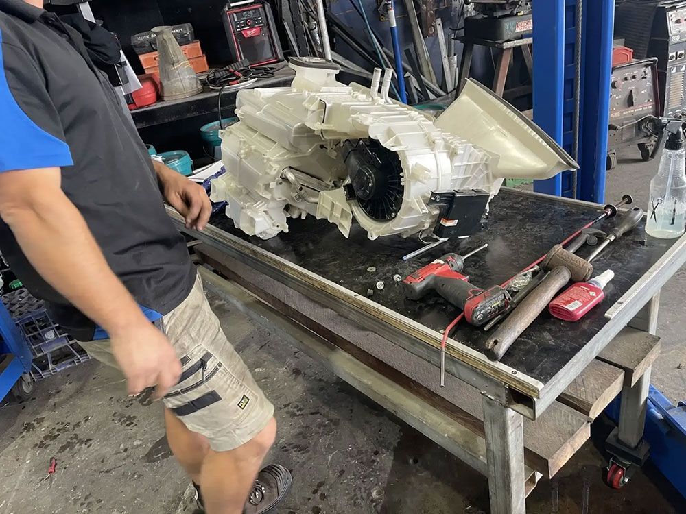Mechanic Repairing The Car Engine On The Table With Tools — Autocool Air Conditioning in Raymond Terrace, NSW