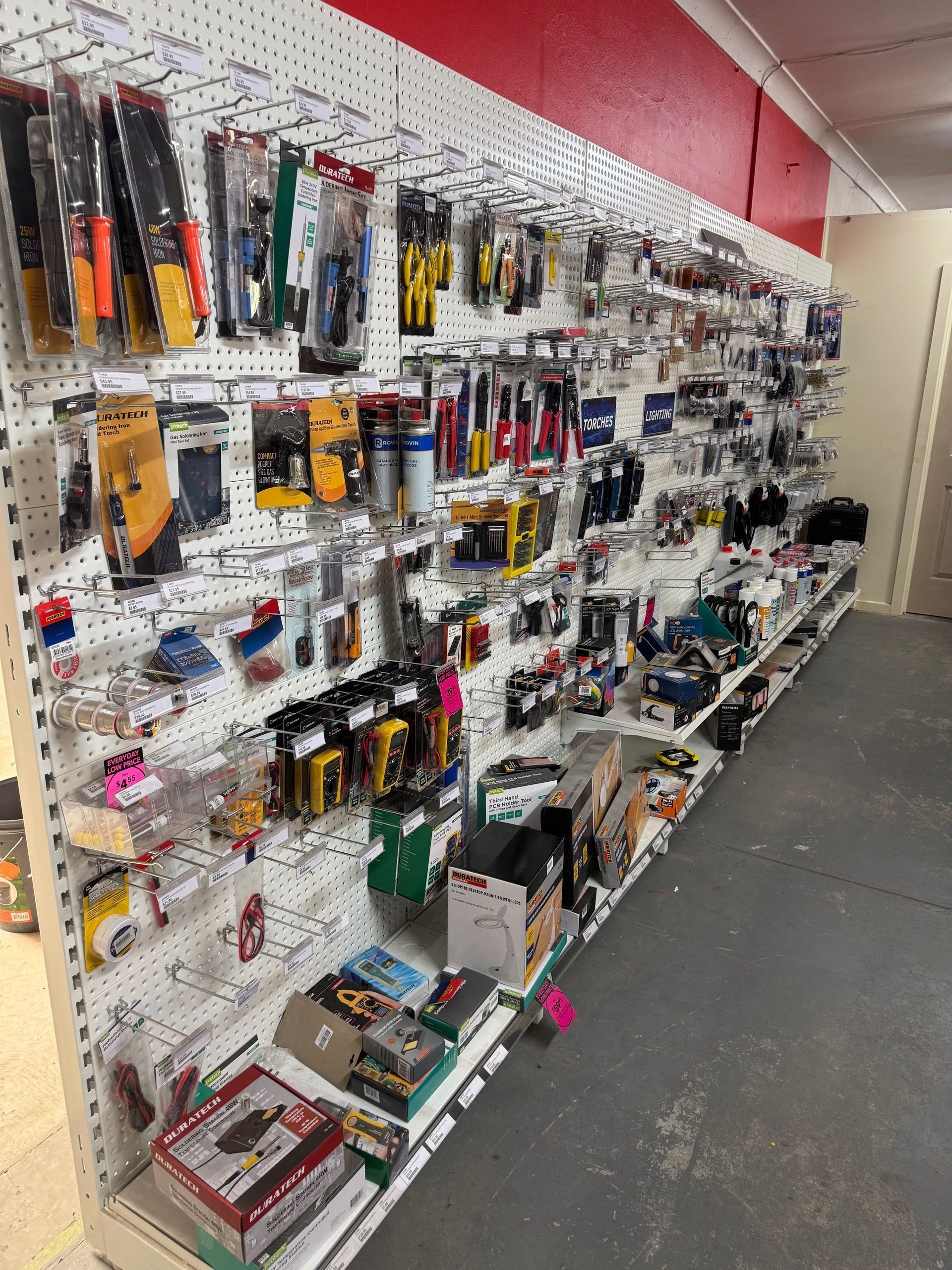 A store filled with lots of shelves filled with lots of batteries.