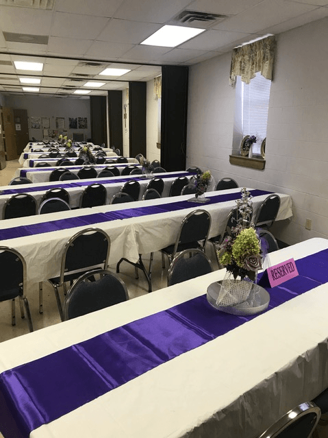 Church Table With Purple Tablecloth Different Angle — Tarrant, AL — Lily Baptist Church