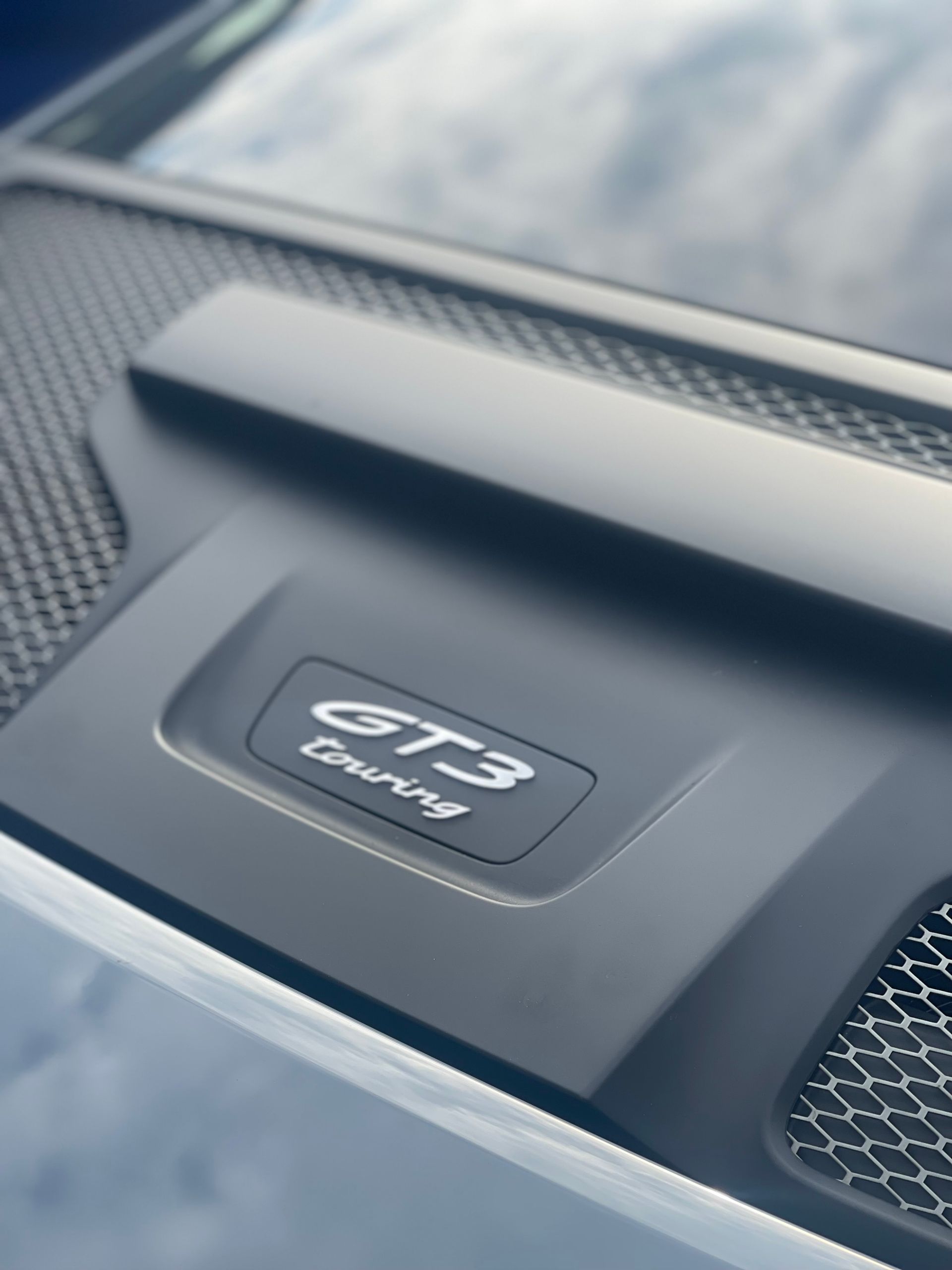 A close up of a porsche gt3 touring engine