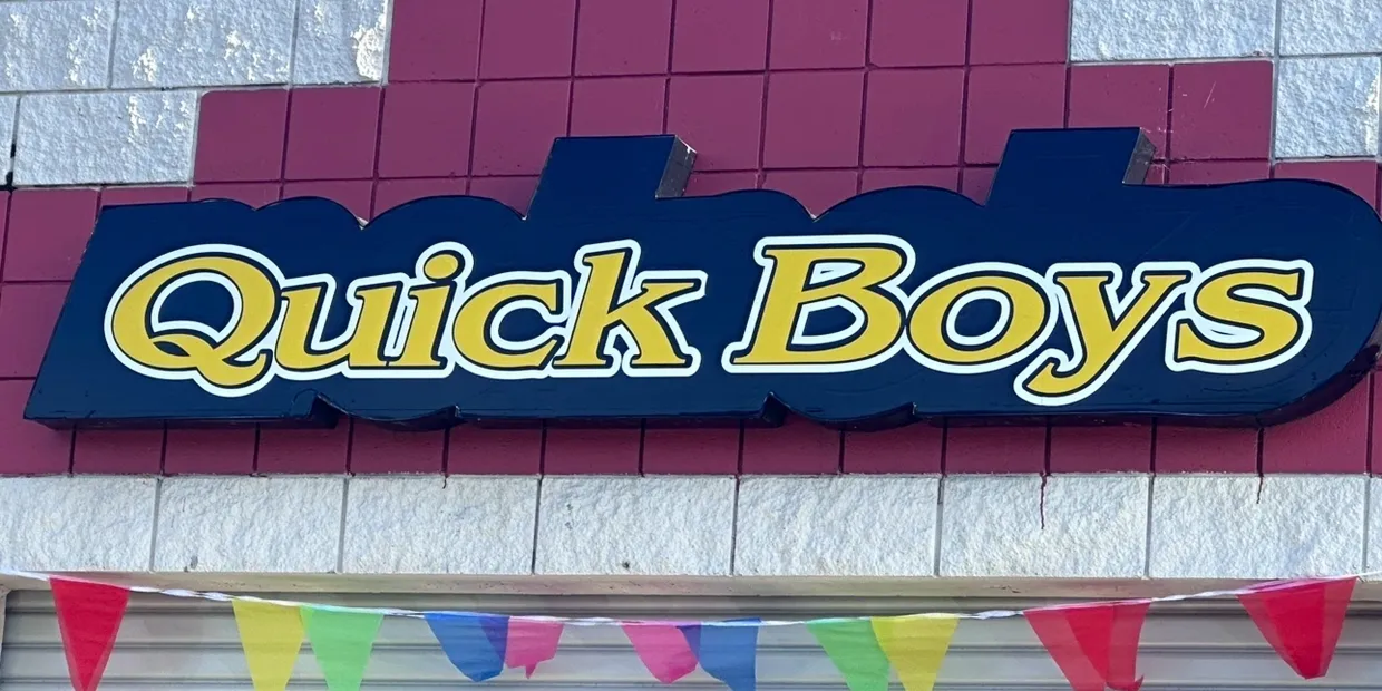 A sign that says quick boys on it | Quick Boys Brake & Tune