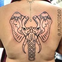 A woman has a tattoo of an elephant on her back.