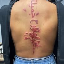 A person with a tattoo on their back.