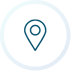 Blue house icon in a white circle.