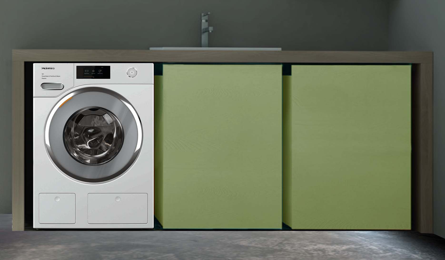 Una lavatrice è posizionata accanto a un lavandino in una lavanderia.