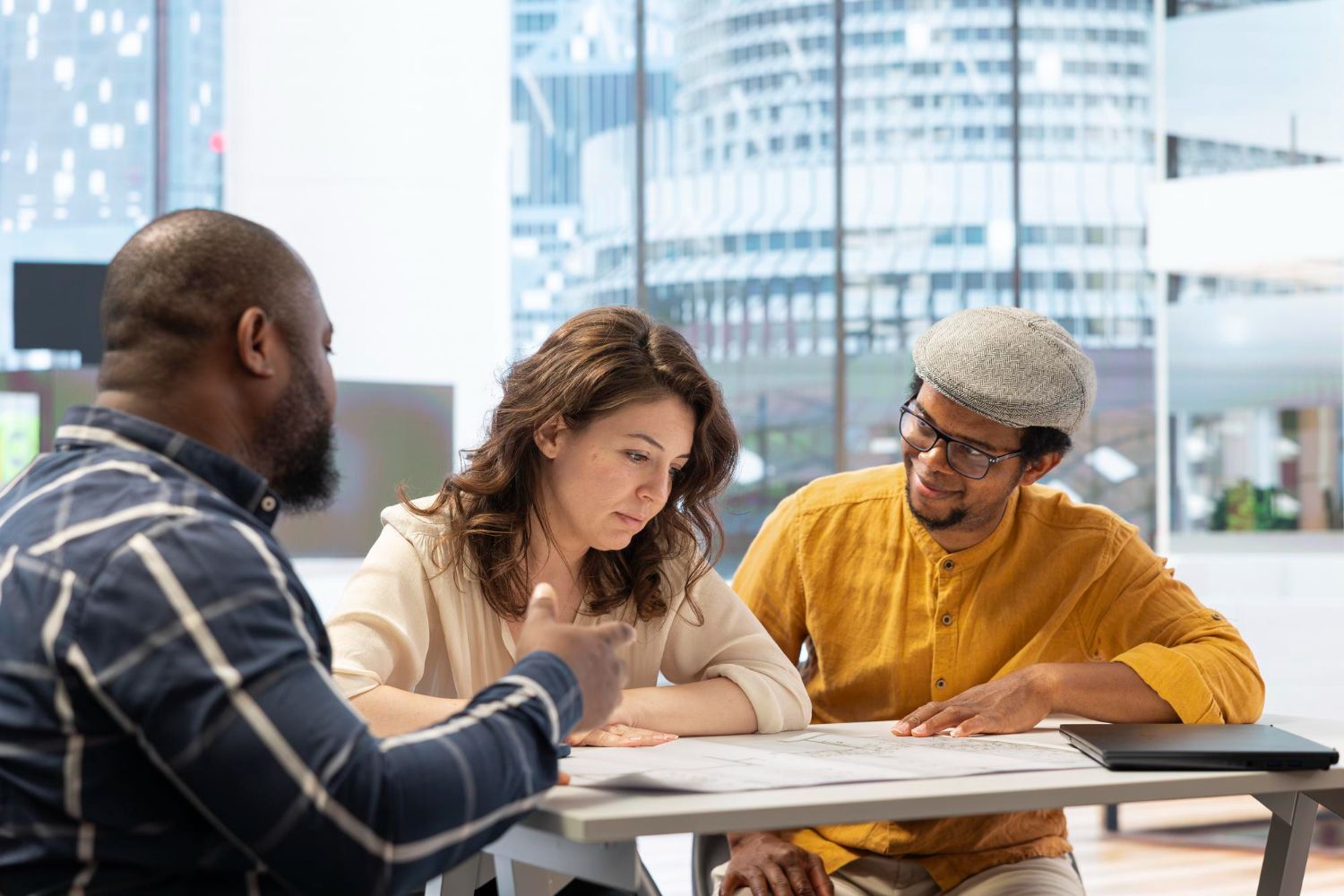 An aerial view of a city at night with lots of tall buildings