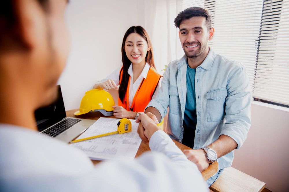 An aerial view of a city at night with lots of tall buildings