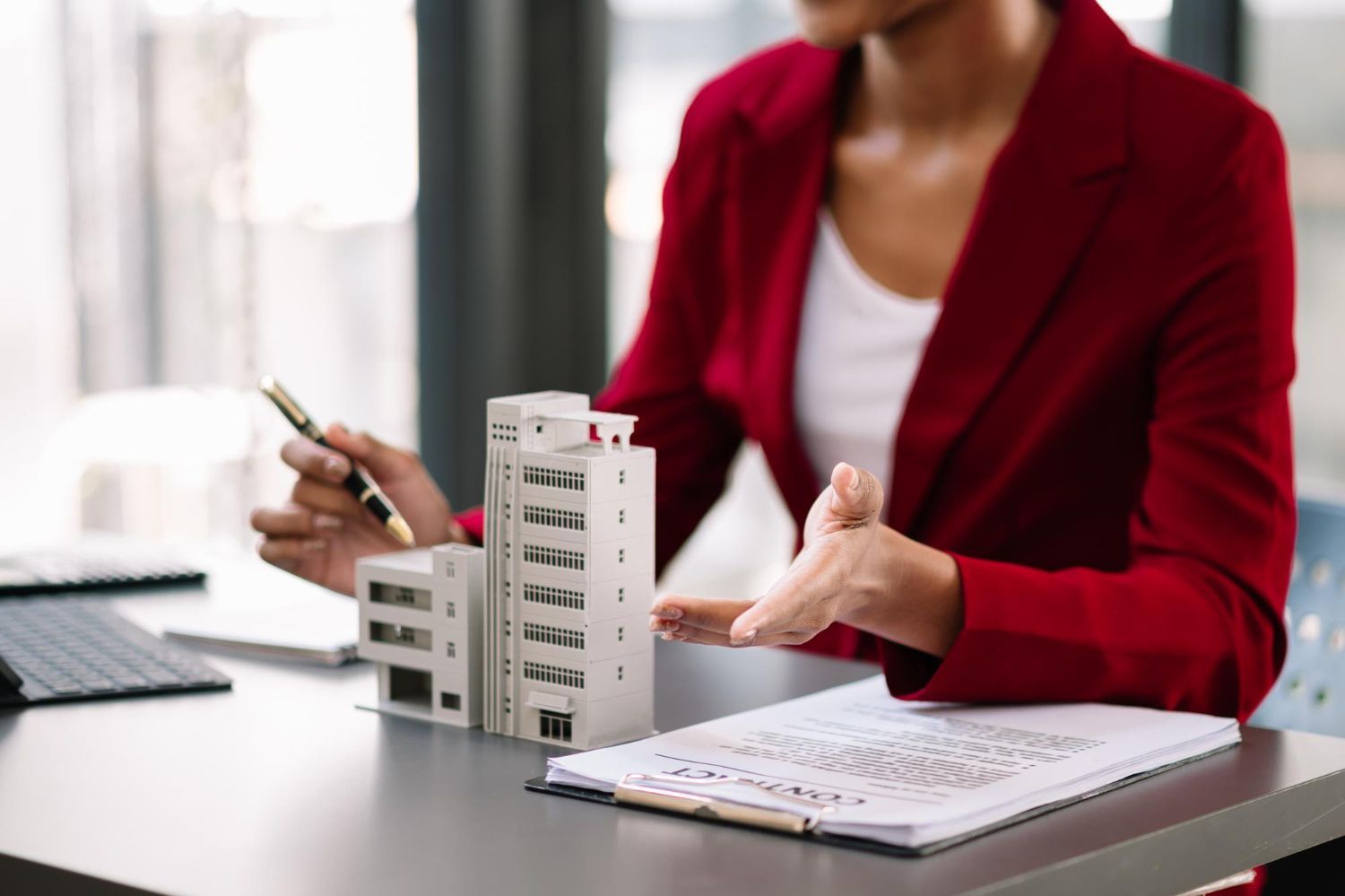 An aerial view of a city at night with lots of tall buildings