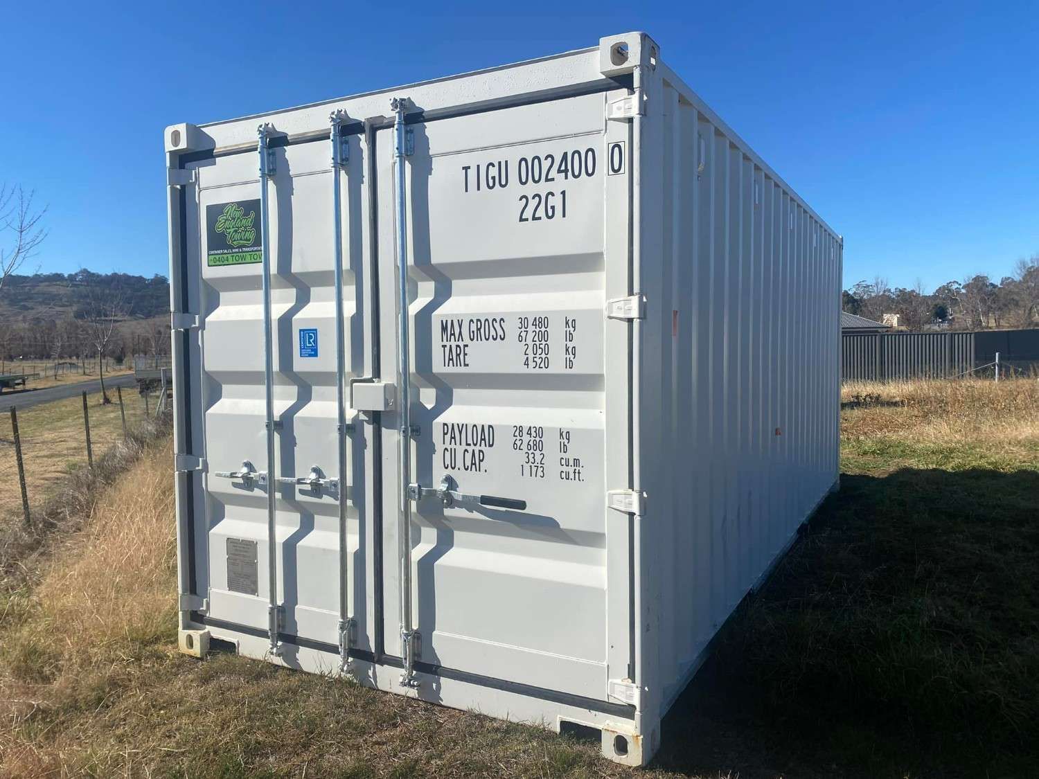 White Shipping Container on A Grassy Field — New England Towing in Guyra, NSW