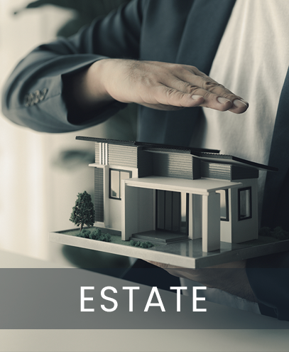 A man in a suit is holding a model house in his hands