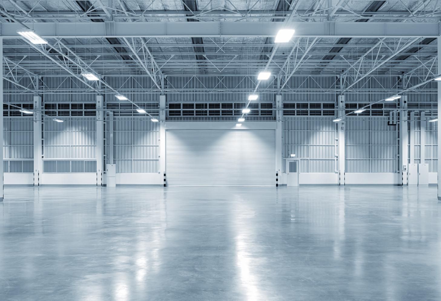 A living room with two couches, a fireplace, and a ceiling fan.