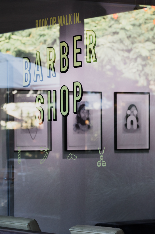 a Man is Getting His Hair Cut by a Barber in a Barber Shop β Habitat Barbershop Byron Bay In Byron Bay, NSW