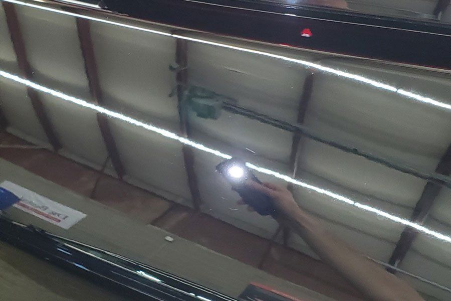 a person is holding a flashlight in front of a garage door