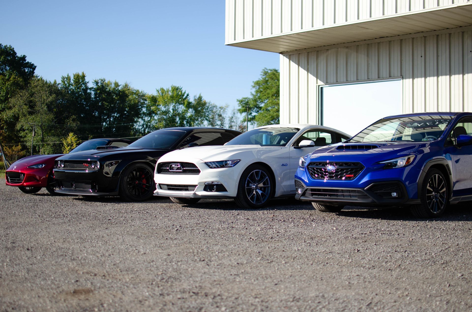 4 Finished Vehicles in front of Keystone Detail. Subaru WRX, Mustang GT, Dodge Challenger