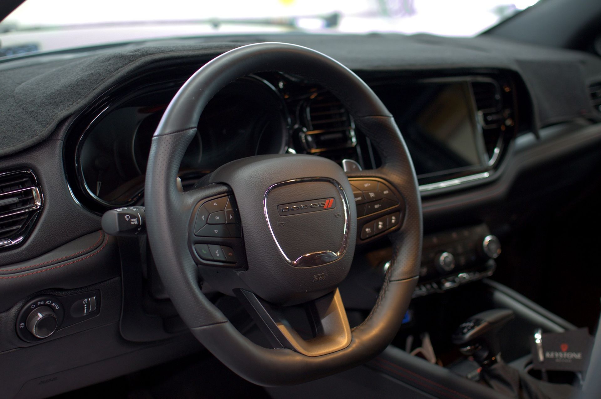 Freshly detailed interior, dashboard and steering wheel of a black Dodge Durango at Keystone Detail in Waterford, PA