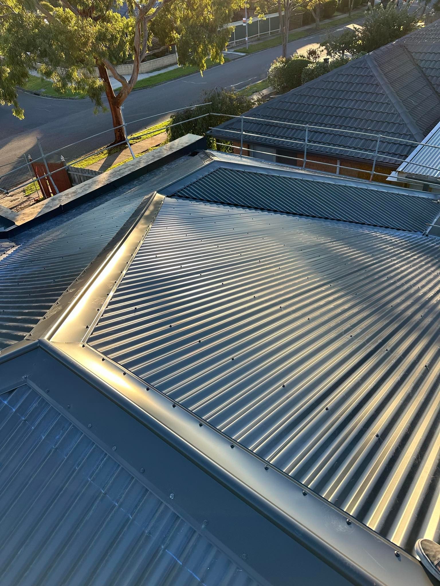 A close up of a roof with a triangle on top of it.