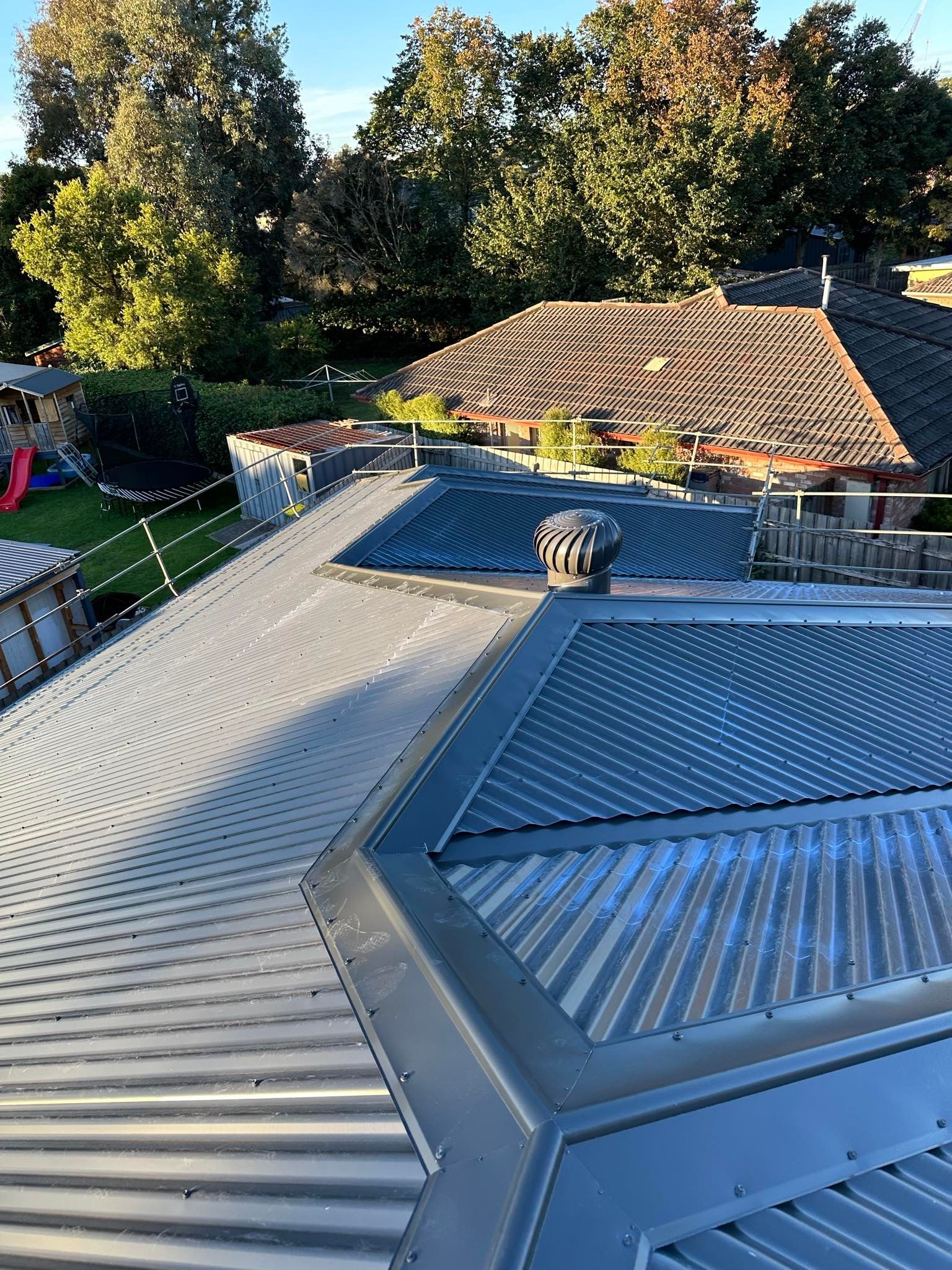 A view of a roof with a street in the background.