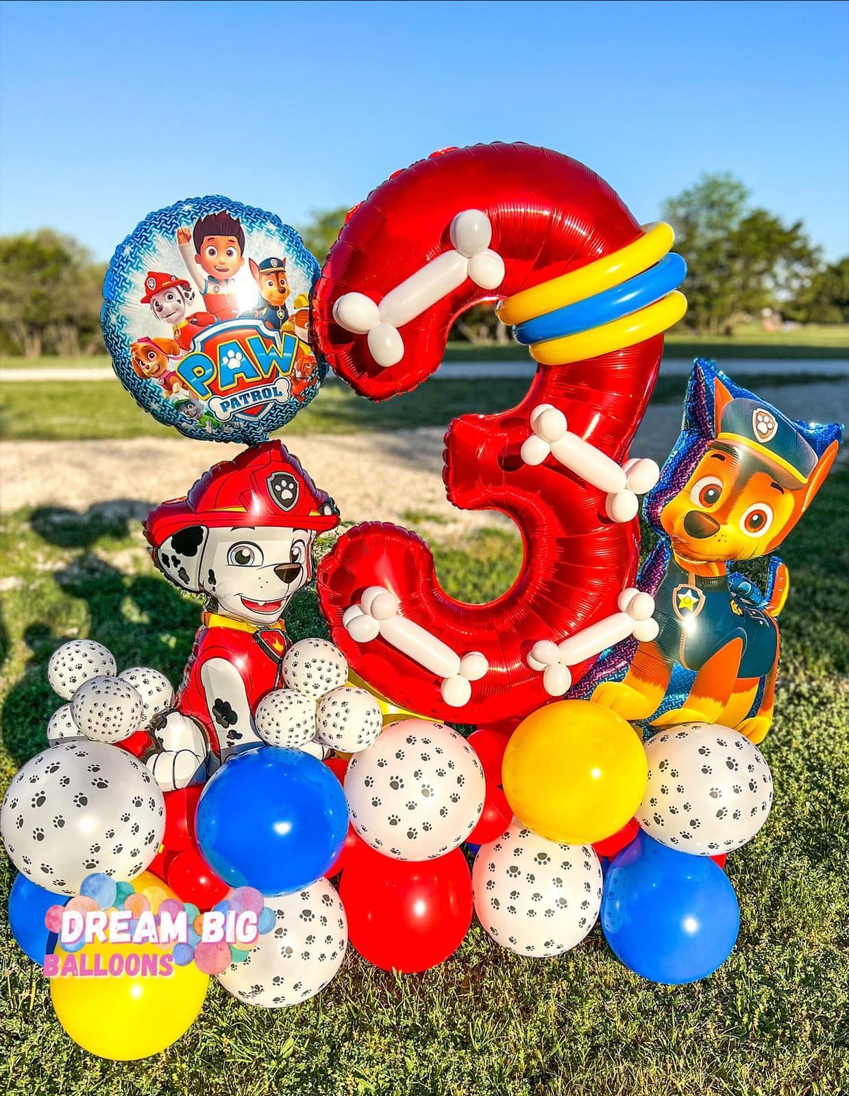 a balloon bouquet with paw patrol balloons and a number three balloon
