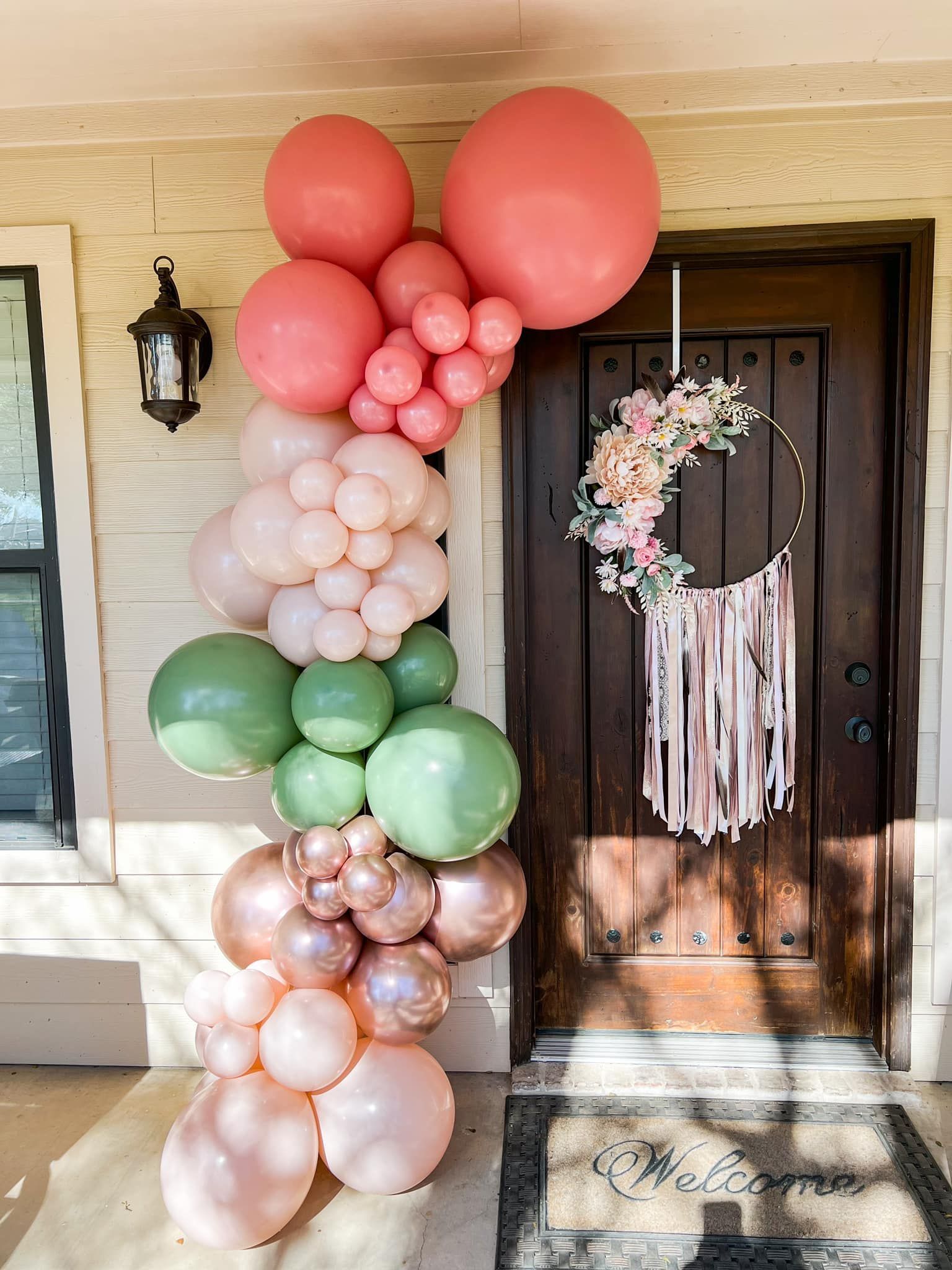 a bunch of balloons are sitting in front of a door