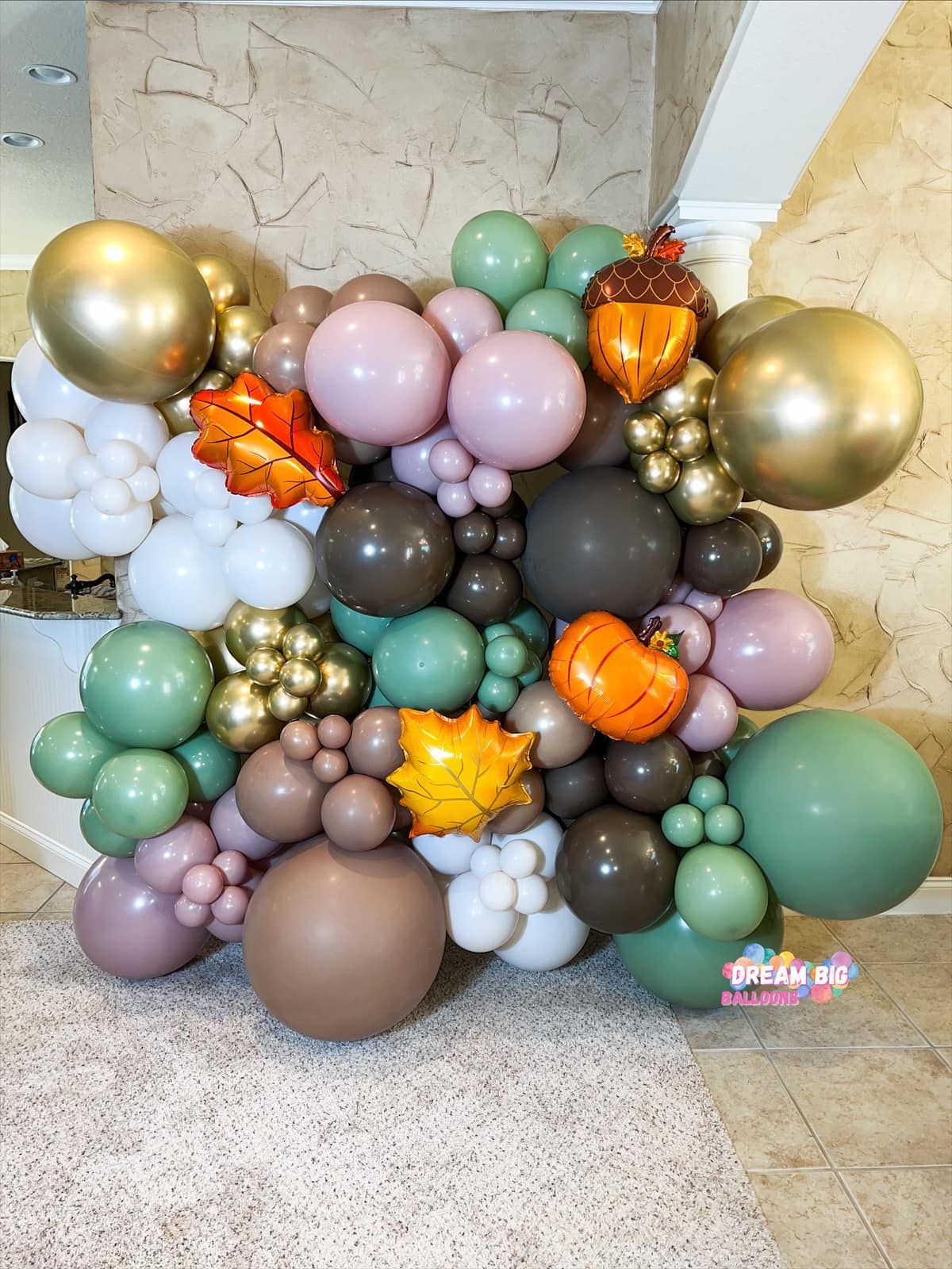 A bunch of balloons are sitting on the floor in a room.