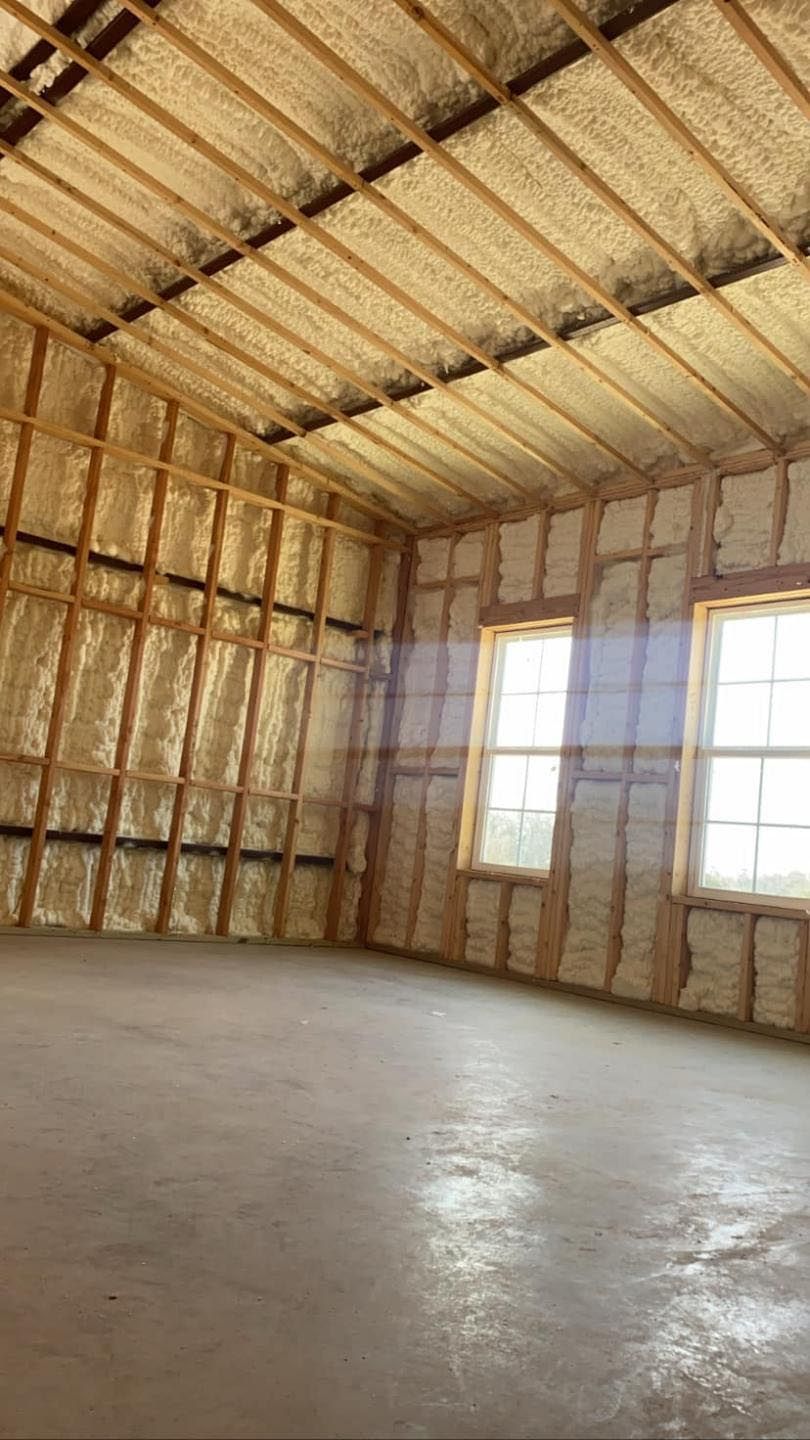 An empty room with a lot of insulation on the walls and ceiling.