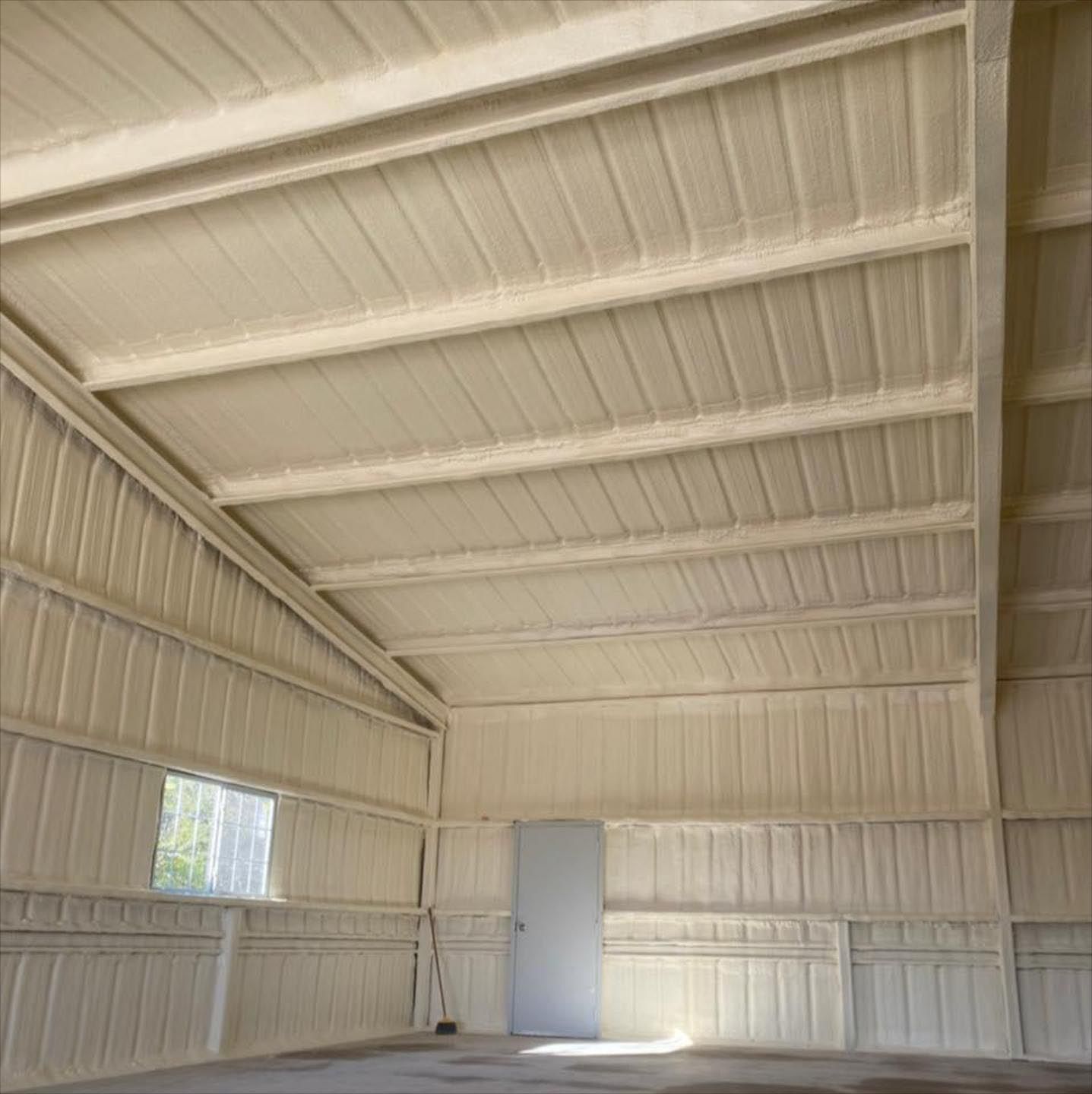 The inside of a building with a ceiling and walls painted white.