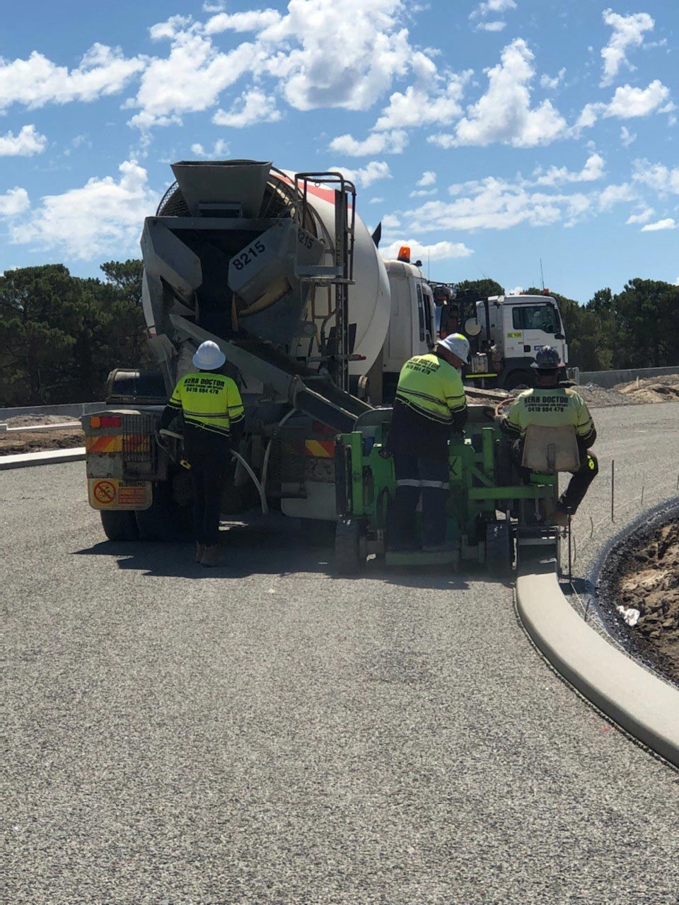 Three men with cement mixer truck | Perth, WA | Kerb Doctor