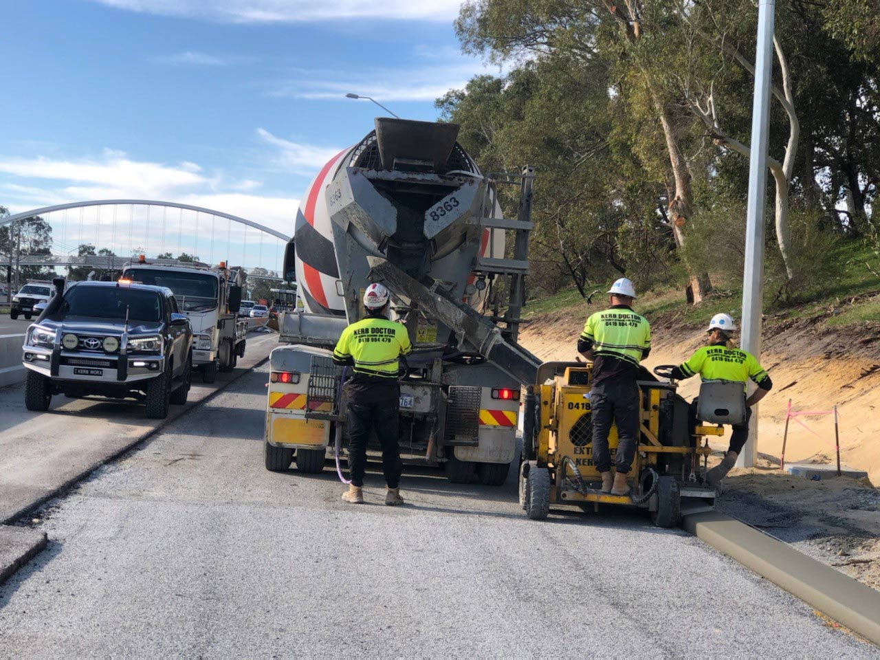 Three men working at roadside kerb | Perth, WA | Kerb Doctor