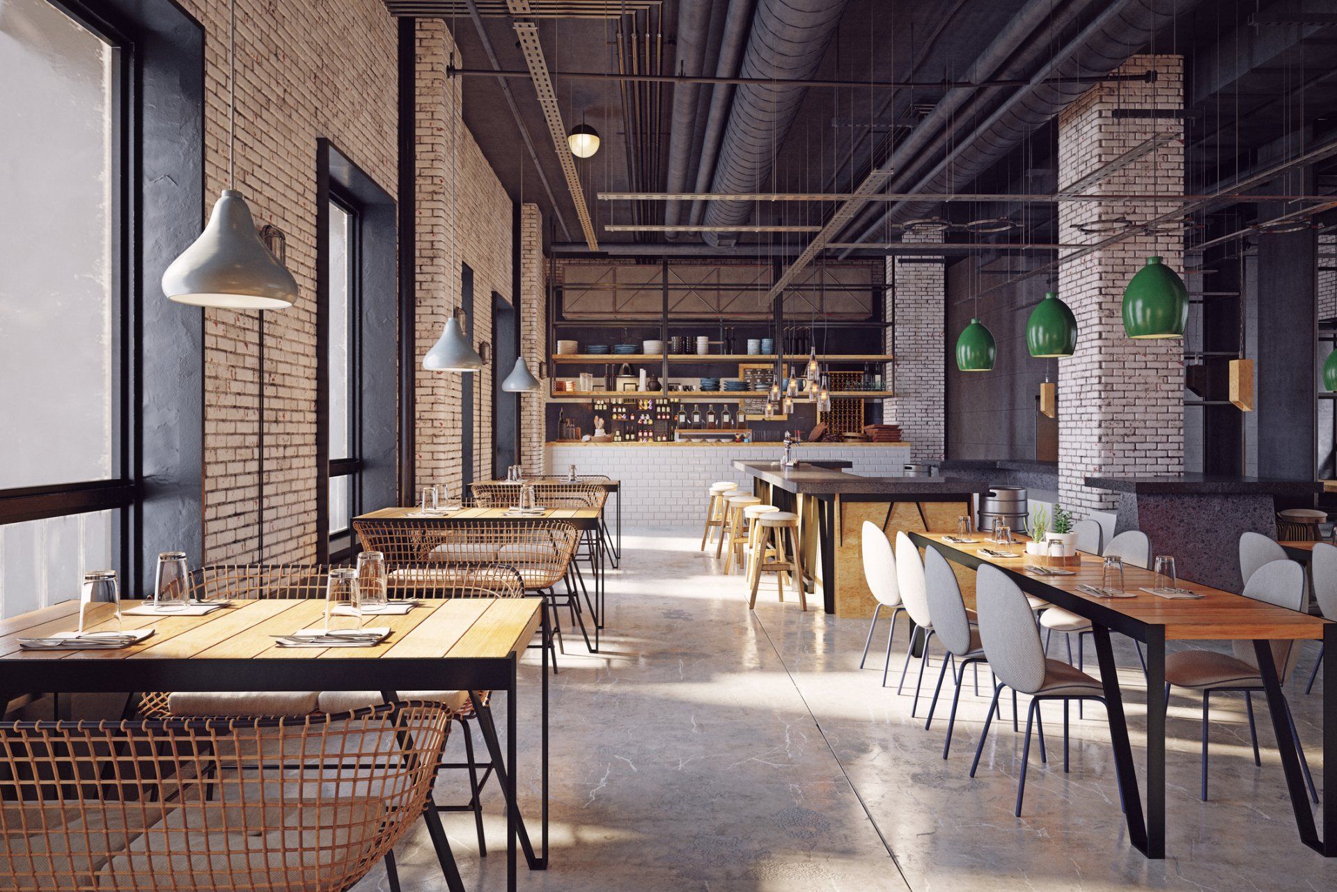 Interior view of a modern restaurant with exposed brick, wooden tables, and pendant lights.