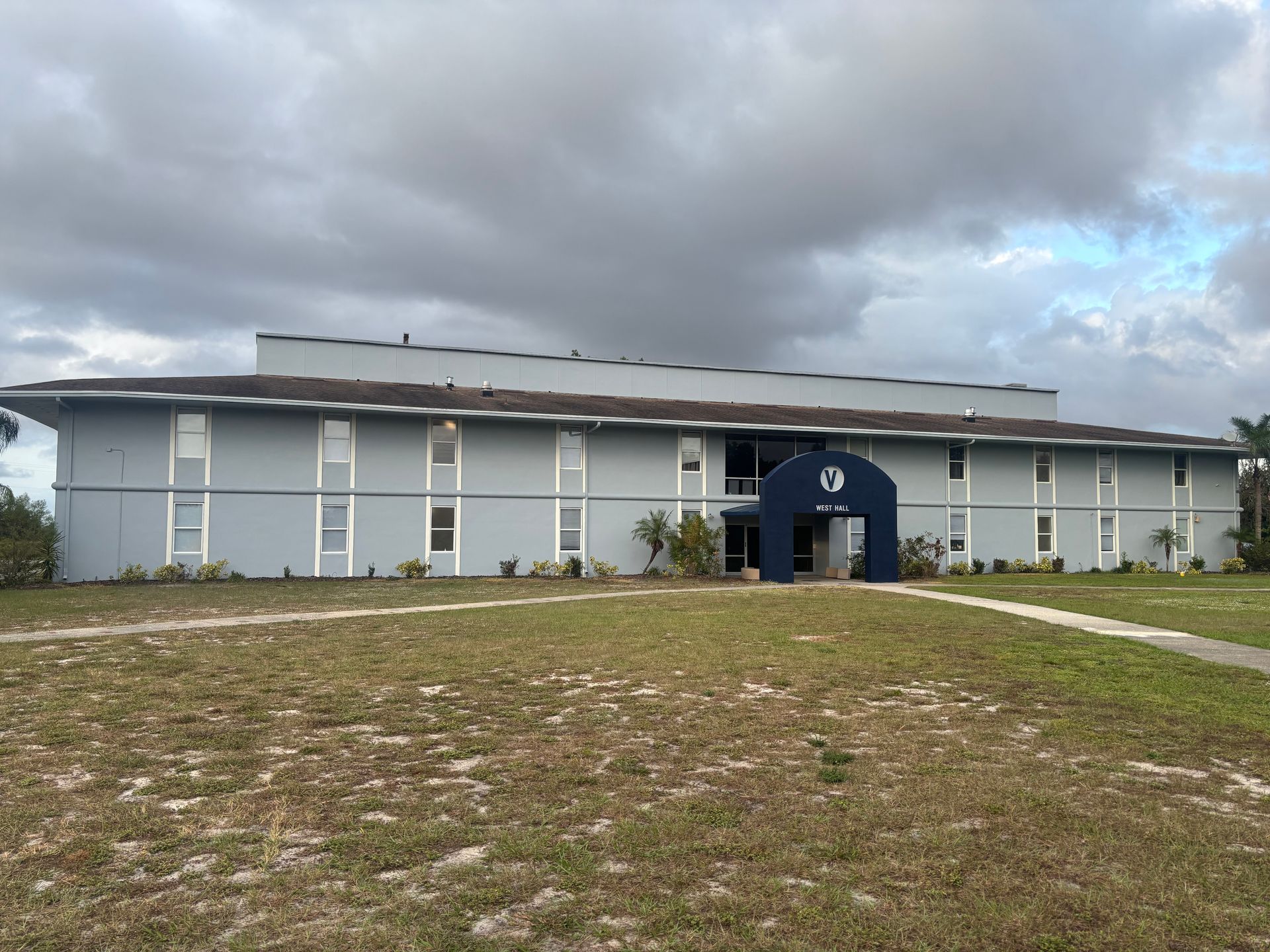 Blue building with arched entrance and 