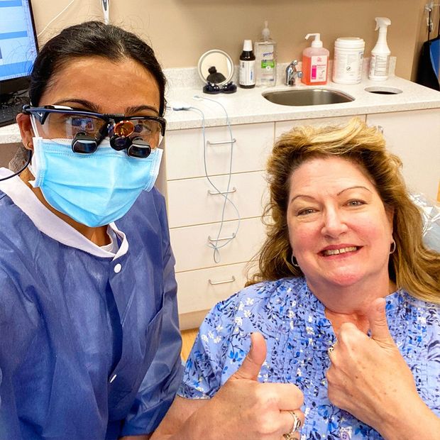 dr ripa and woman smiling