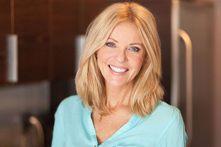 elderly patient smiling after teeth whitening