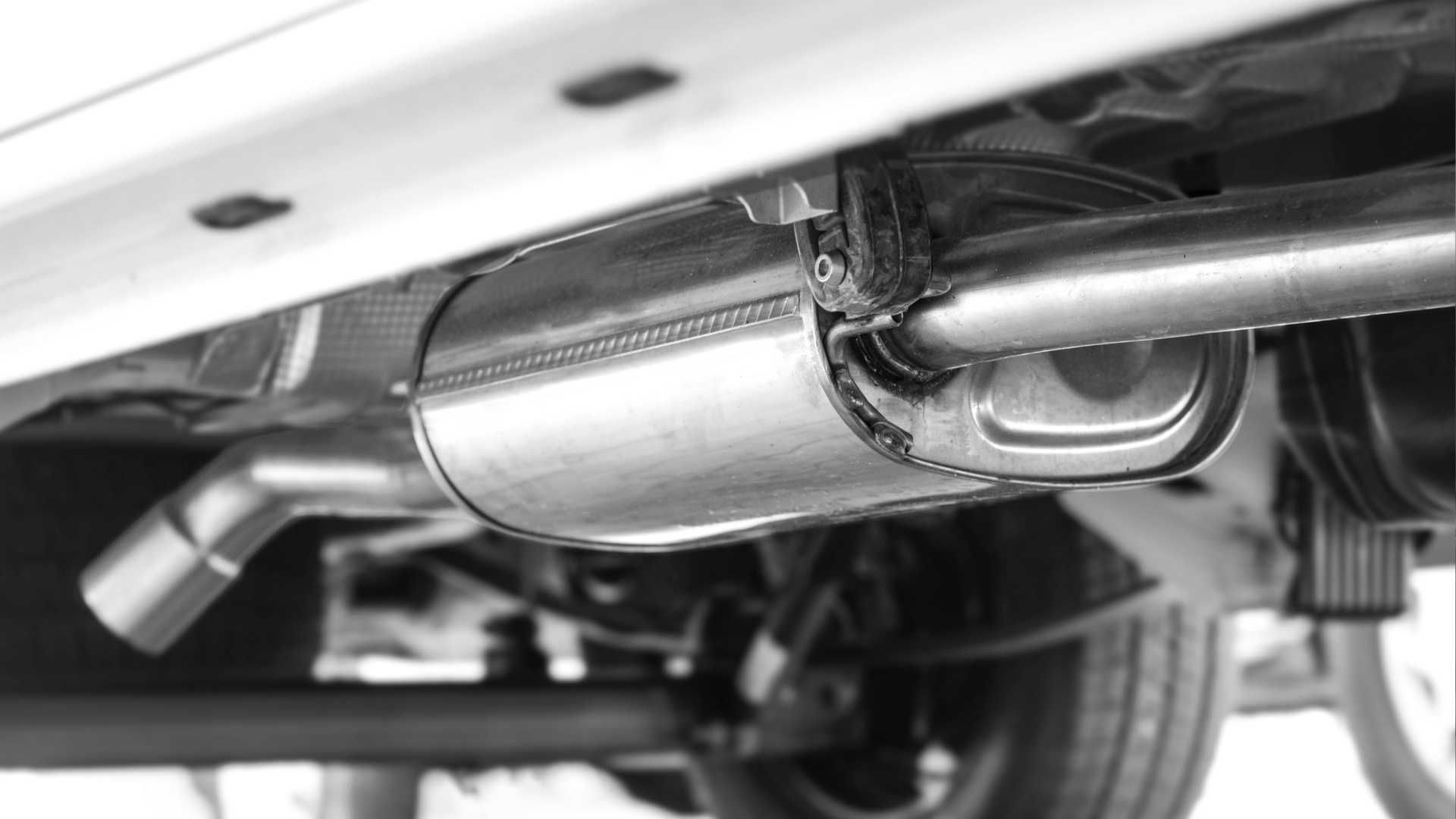 a shiny new Catalytic Converter mounted on the underside of a car